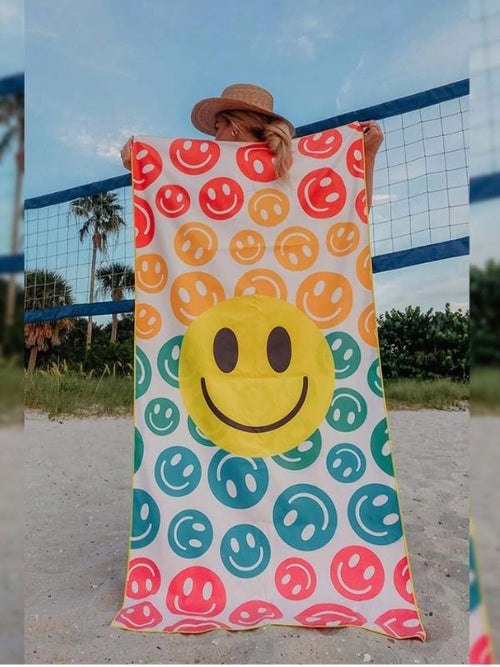 Smiley Face Microfiber Beach Towel absorbs 4 times as much water as a regular towel.