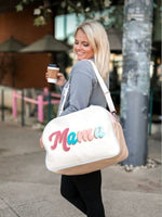 Adorable MAMA duffle bag in cream, with canvas lettering in mauve, aqua, pink and baby blue. 