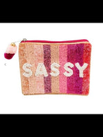 Handmade sassy beaded coin purse with pom zipper.