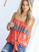 Strapless top in orange and navy with a front tie. 